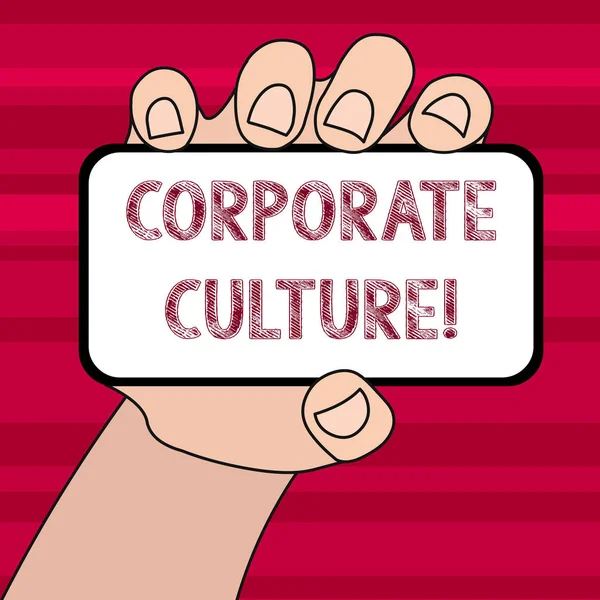 Conceptual hand writing showing Corporate Culture. Business photo text beliefs and attitudes that characterize a company Closeup of Smartphone in Hand with Blank Screen and Text Space.
