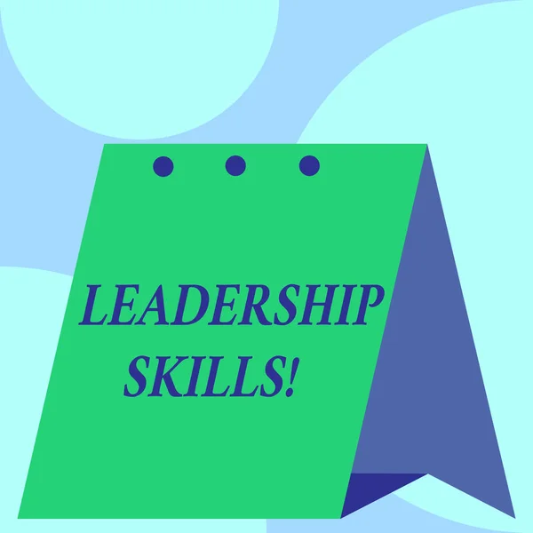 Text sign showing Leadership Skills. Conceptual photo Skills and qualities that leaders possess Taking a lead Open big standing calendar Desk monthly planner Geometrical background.
