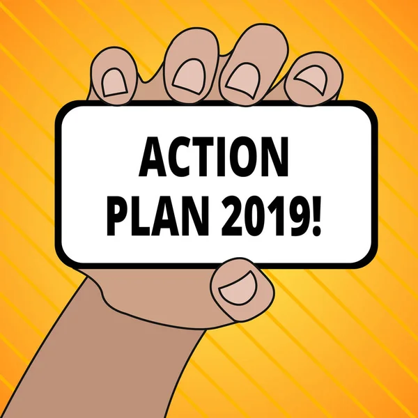 Text sign showing Action Plan 2019. Conceptual photo proposed strategy or course of actions for current year Closeup of Smartphone Device Held in Hand with Blank Screen and Text Space.