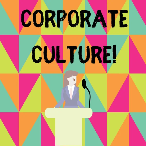 Word writing text Corporate Culture. Business concept for beliefs and attitudes that characterize a company Businesswoman Standing Behind Podium Rostrum Speaking on Wireless Microphone.