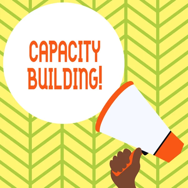 Conceptual hand writing showing Capacity Building. Business photo showcasing Strengthen the abilities of individuals Workforce planning Hand Holding Loudhailer Speech Text Balloon Announcement New. — Stock Photo, Image