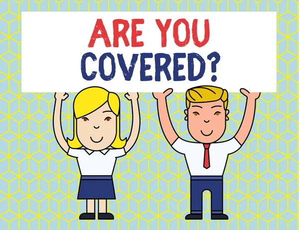 Handwriting text Are You Covered Question. Concept meaning asking showing if they had insurance in work or life Two Smiling People Holding Big Blank Poster Board Overhead with Both Hands.