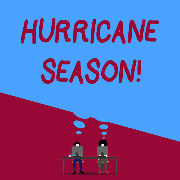Handwriting text writing Hurricane Season. Concept meaning time when most tropical cyclones are expected to develop Man with purple trousers sit on chair talk to fellow near computer table.
