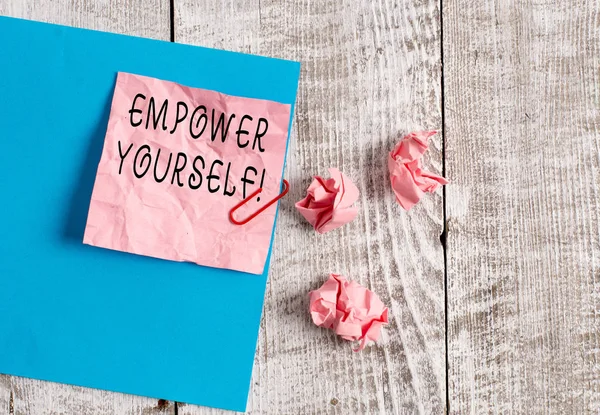 Writing note showing Empower Yourself. Business photo showcasing taking control of our life setting goals and making choices Wrinkle paper and cardboard placed above wooden background. — Stock Photo, Image