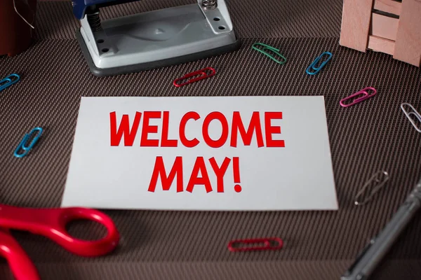 Text sign showing Welcome May. Conceptual photo welcoming fifth month of year usually considered summer Scissors and writing equipments plus plain sheet above textured backdrop.