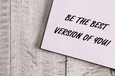 Conceptual hand writing showing Be The Best Version Of You. Business photo showcasing going to move away from where are start improving Notebook stationary placed above classic wooden backdrop.