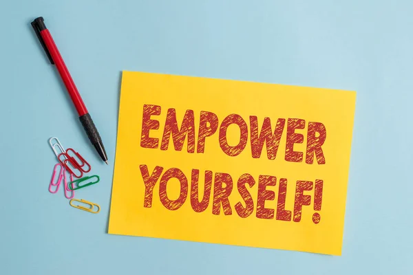 Handwriting text Empower Yourself. Concept meaning taking control of our life setting goals and making choices Plain cardboard and writing equipment placed above pastel colour backdrop. — Stock Photo, Image