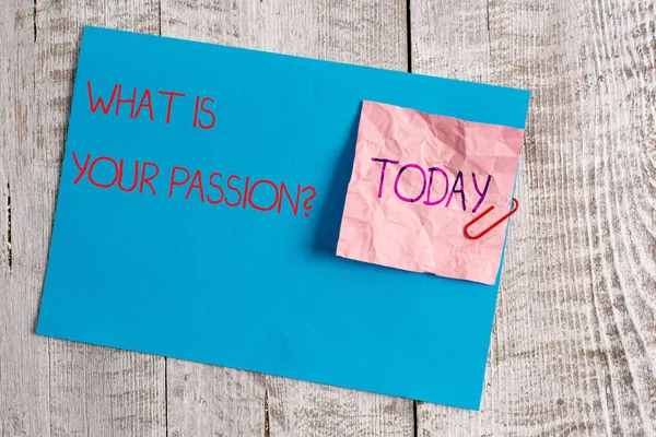 Handwriting text What Is Your Passion Question. Concept meaning asking about his strong and barely controllable emotion Wrinkle paper and cardboard plus stationary placed above wooden background. — Stock Photo, Image