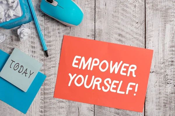 Handwriting text writing Empower Yourself. Concept meaning taking control of our life setting goals and making choices Crumpled paper in bin and computer mouse with stationary on wooden backdrop. — Stock Photo, Image