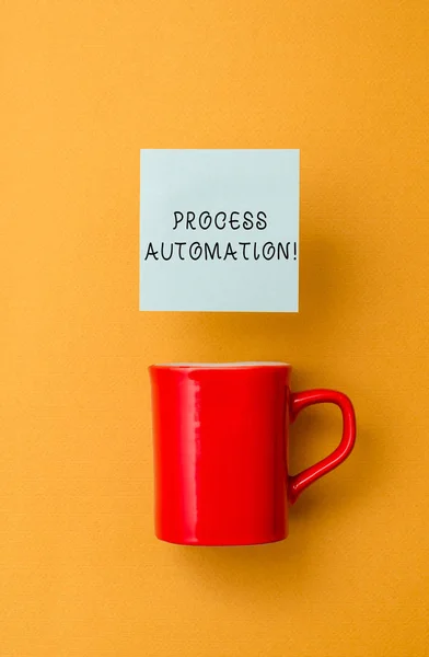 Conceptual hand writing showing Process Automation. Business photo text Transformation Streamlined Robotic To avoid Redundancy Front view coffee cup colored sticky note yolk color background. — Stock Photo, Image