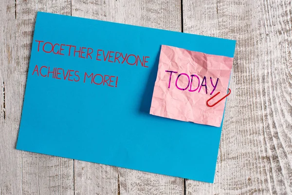 Handwriting text Together Everyone Achieves More. Concept meaning Members create synergy with strong sense mutual commitment Wrinkle paper and cardboard plus stationary placed above wooden background. — Stock Photo, Image