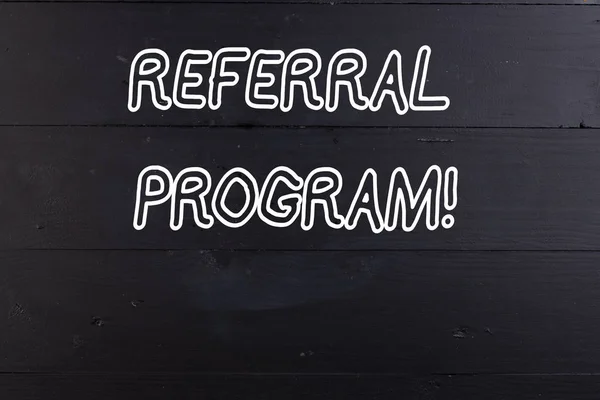 Word writing text Referral Program. Business concept for internal recruitment method employed by organizations Wooden texture old vintage background horizontal boards holes. Old vintage.
