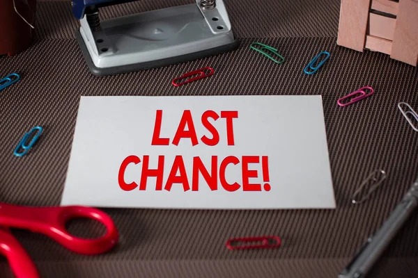 Text sign showing Last Chance. Conceptual photo final opportunity to achieve or acquire something you want Scissors and writing equipments plus plain sheet above textured backdrop.