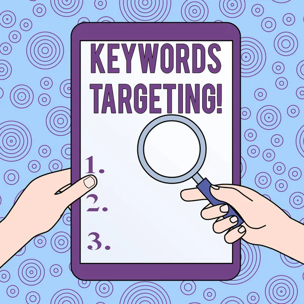 Conceptual hand writing showing Keywords Targeting. Business photo showcasing Use Relevant Words to get High Ranking in Search Engines Hands Holding Magnifying Glass Against Switched Off Tablet. — Stock Photo, Image