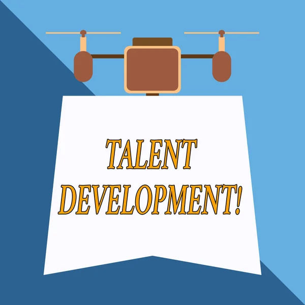 Writing note showing Talent Development. Business photo showcasing Building Skills Abilities Improving Potential Leader Drone holding downwards banner. Geometrical abstract background design.