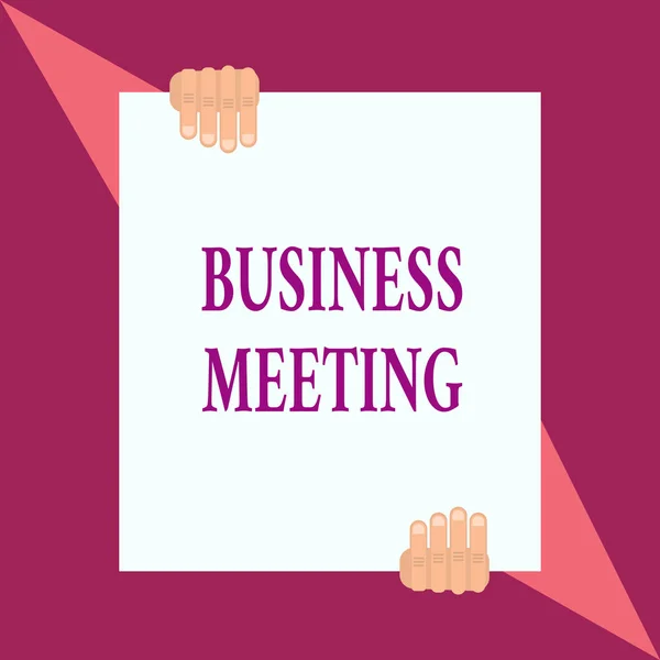 Conceptual hand writing showing Business Meeting. Business photo showcasing used discuss issues that cannot be addressed in simple way Two hands hold one big white paper placed on top and bottom.