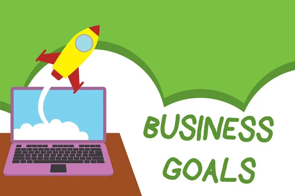 Text sign showing Business Goals. Conceptual photo Expectation to accomplish over a specific period of time Successful rocket launching clouds out laptop background. Startup growing. — Stok fotoğraf