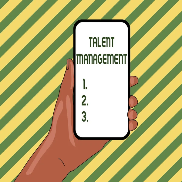 Handwriting text Talent Management. Concept meaning Acquiring hiring and retaining talented employees Closeup of Smartphone Device Held in Hand with Empty Screen and Text Space.