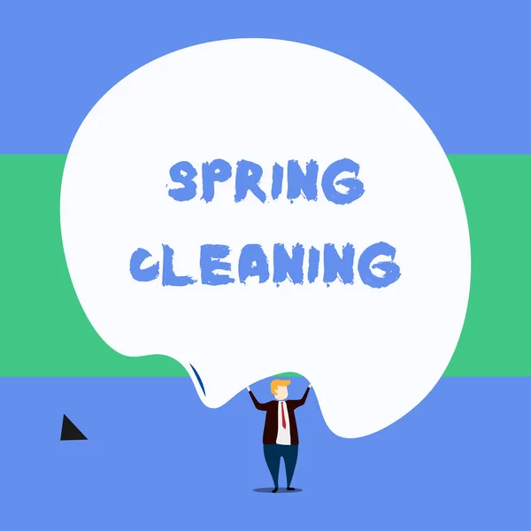 Text sign showing Spring Cleaning. Conceptual photo practice of thoroughly cleaning house in the springtime Front view standing man dressed suit tie two hands up big deflated balloon. — Stock Photo, Image