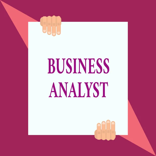 Conceptual hand writing showing Business Analyst. Business photo showcasing someone who analyzes big organization or website domain Two hands hold one big white paper placed on top and bottom.