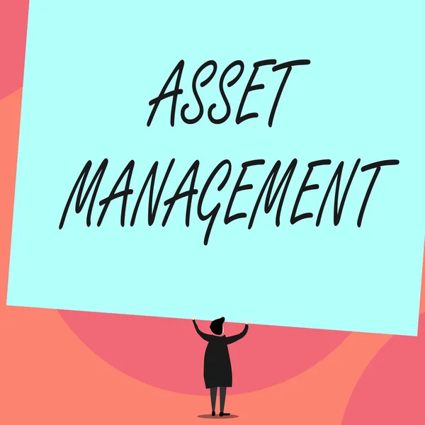 Word writing text Asset Management. Business concept for systematic process of operating and disposing of assets Back view standing short hair woman dress hands up holding blank rectangle.