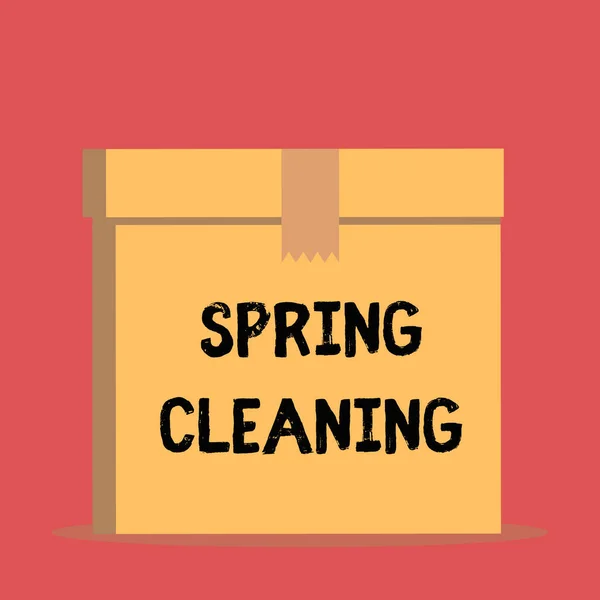 手書きテキストスプリングクリーニング。コンセプトは、春に徹底的に家を掃除する実践を意味する前景を開いて茶色の段ボール密封箱蓋を閉じます。空白の背景. — ストック写真