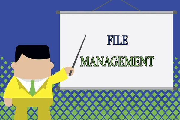 Writing note showing File Management. Business photo showcasing computer program that provides user interface to analysisage data Businessman standing in front projector screen pointing project idea.