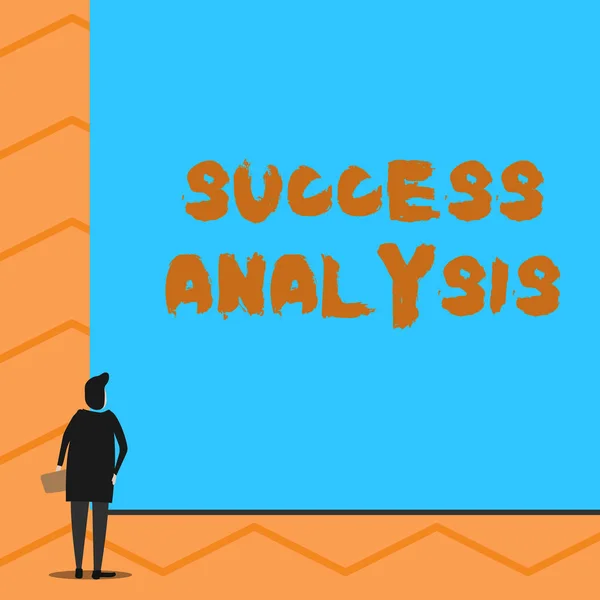 Text sign showing Success Analysis. Conceptual photo creating graph to determine increase in sales or profits Man stands in back view in front of huge empty blank big rectangle board.