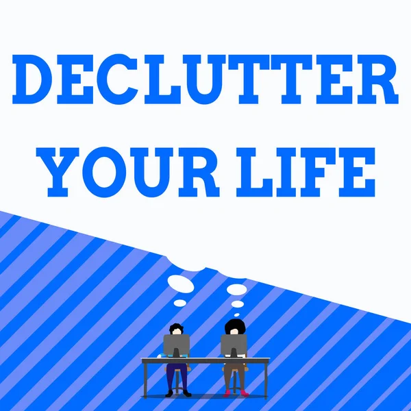 Writing note showing Declutter Your Life. Business photo showcasing To eliminate extraneous things or information in life Man with purple trouser sit on chair talk to fellow near computer table. — 스톡 사진