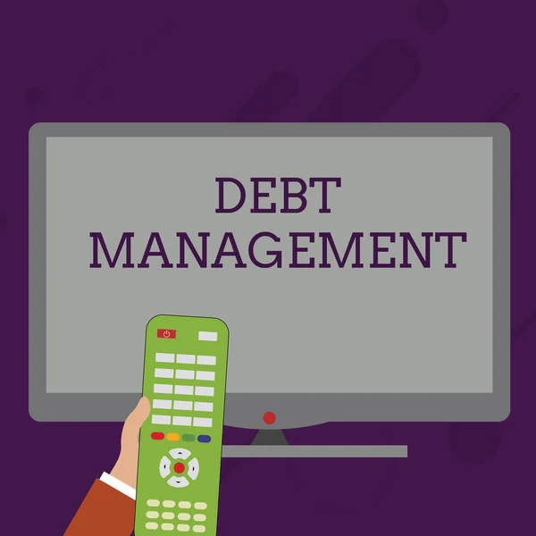 Word writing text Debt Management. Business concept for The formal agreement between a debtor and a creditor Hand Holding Computer Remote Control infront of Blank Wide Color PC Screen. — 스톡 사진