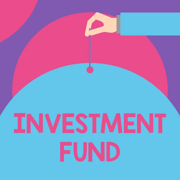 Handwriting text Investment Fund. Concept meaning A supply of capital belonging to numerous investors Male hand arm needle punching big half blank balloon geometrical background.