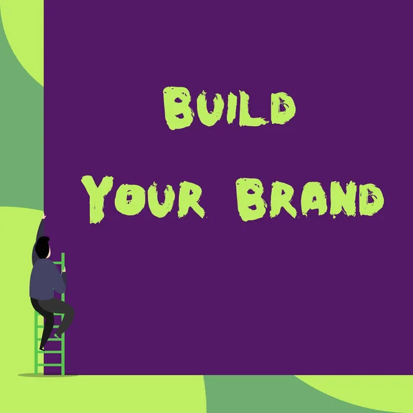 Знак Build Your Brand. Концептуальные фото повышения равенства бренда с помощью рекламных кампаний назад вид молодой человек поднимаясь по лестнице лестницы лежит большой пустой прямоугольник . — стоковое фото