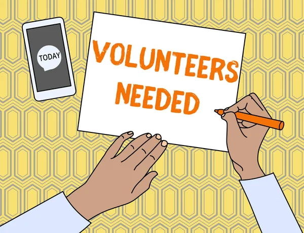 Text sign showing Volunteers Needed. Conceptual photo need work or help for organization without being paid Top View Man Writing Blank Paper Pen Pencil Marker Smartphone Message Icon.
