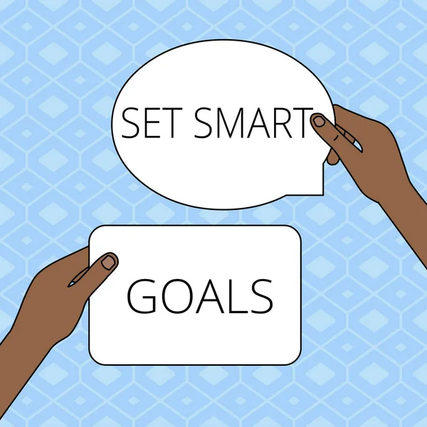 Schrijfbriefje met Set Smart Goals. Zakelijke foto presentatie geven criteria om te begeleiden bij de vaststelling van de doelstellingen Twee Getallen Tabletten Tekens Held in Handen Een Boven andere Tekstruimte. — Stockfoto