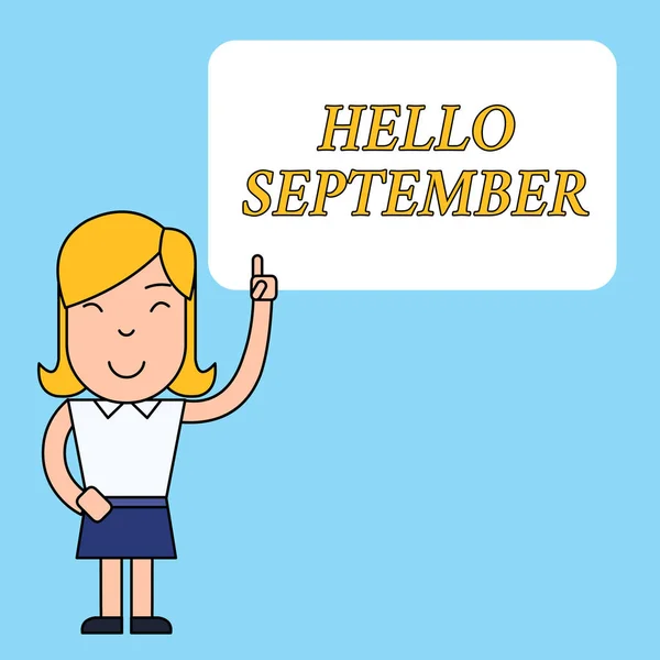写便条，上面写着"你好，九月" 这张商业照片展示了一位热切希望获得9月份热烈欢迎的女性，她站在空白文本框边，带着左撇子指尖站在那里. — 图库照片