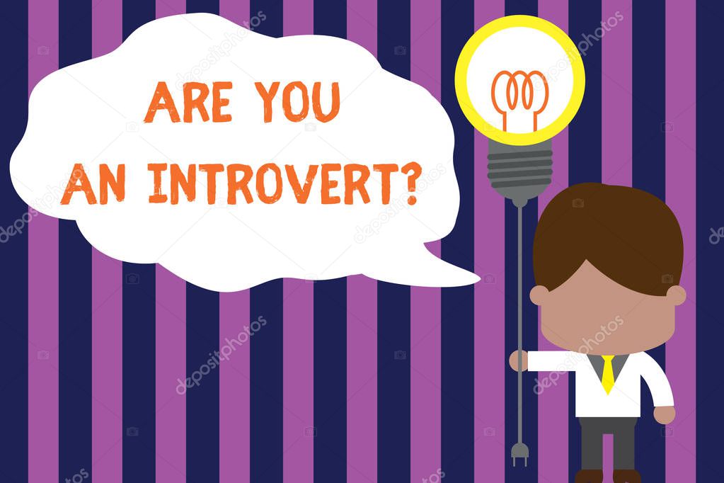 Text sign showing Are You An Introvertquestion. Conceptual photo demonstrating who tends to turn inward mentally Standing man tie holding plug socket light bulb to connect idea. Startup.
