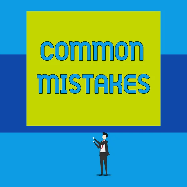 Word writing text Common Mistakes. Business concept for actions that are often used interchangeably with error Isolated view young man standing pointing upwards two hands big rectangle. — 스톡 사진