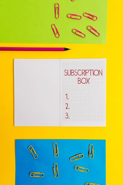 Text sign showing Subscription Box. Conceptual photo button if you clicked on will get news or videos about site Blank squared notebook pencil marker paper sheets plain colored background. — Stock Photo, Image