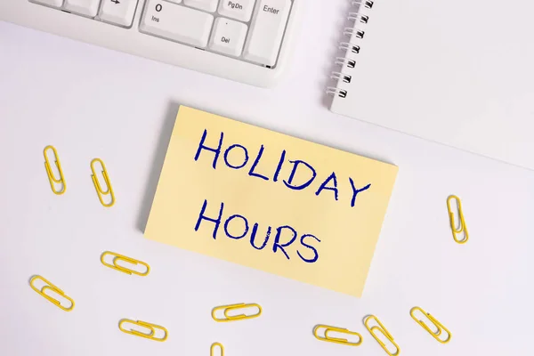 Holiday Hours 'u gösteren kavramsal el yazısı. İş fotoğrafçıları saatlerce normal ücretlerinin iki katını alıyor.. — Stok fotoğraf