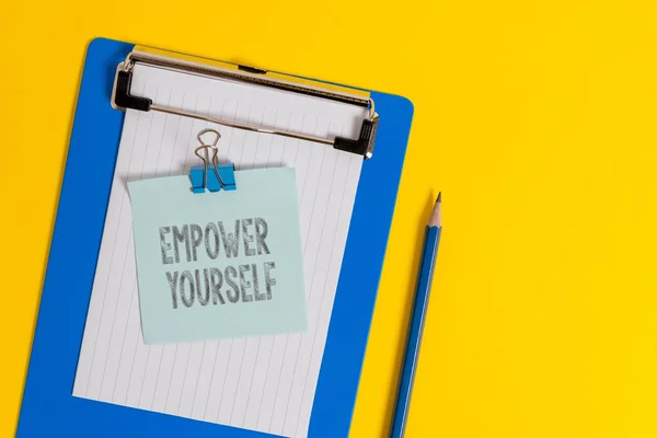 Handwriting text writing Empower Yourself. Concept meaning taking control of life setting goals positive choices Clipboard holding blank paper sheet note binder pencil colored background. — Stock Photo, Image