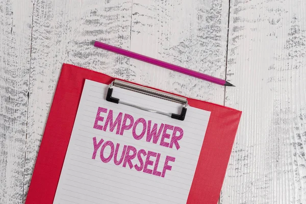 Handwriting text Empower Yourself. Concept meaning taking control of life setting goals positive choices Colored clipboard blank paper sheet pencil old wooden vintage background. — Stock Photo, Image