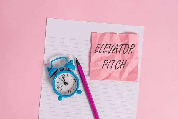 Writing note showing Elevator Pitch. Business photo showcasing A persuasive sales pitch Brief speech about the product Striped paper sheet note pencil vintage alarm clock colored background. — Stock Photo, Image
