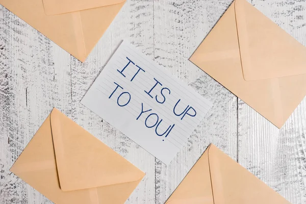 Text sign showing It Is Up To You. Conceptual photo Used to tell a demonstrating that they are the one to decide Four envelopes around ruled paper sheet old wooden vintage background. — Stock Photo, Image