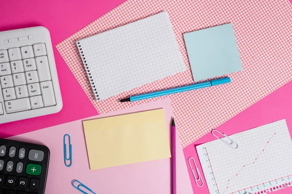 Writing equipments and computer stuffs plus mathematic paper placed on a colored backdrop. Stationary, math book near tools of data processing machine above plain table. — Stock Photo, Image