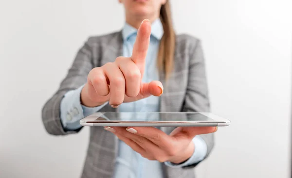 Business woman pointing with finger. Empty space for text message with hand and finger pointing on it. Digital business concept with business woman.