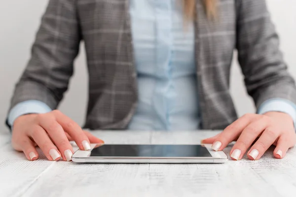 Business woman sitting with mobile phone on the table. Business concept with communication mobile phone.