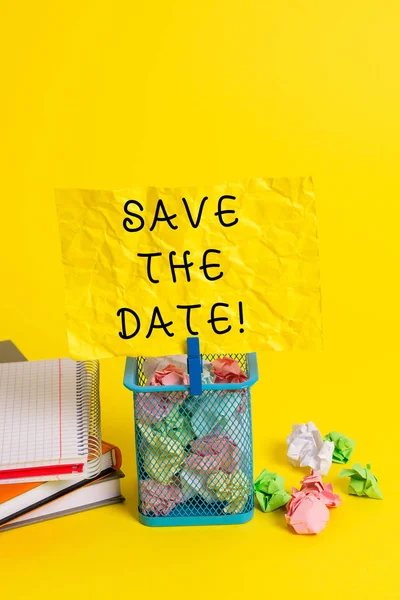 Conceptual hand writing showing Save The Date. Business photo showcasing Organizing events well make day special event organizers Trash bin crumpled paper clothespin office supplies yellow.