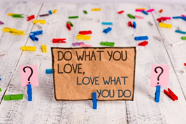 Conceptual hand writing showing Do What You Love Love What You Do. Business photo text you able doing stuff you enjoy it to work in better places then Crumbling sheet with paper clips placed on the — Stock Photo, Image