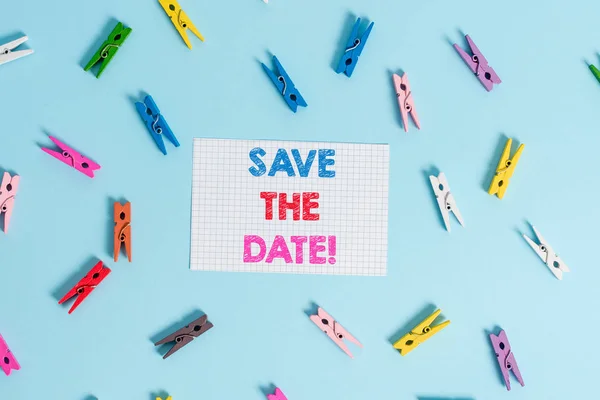 Handwriting text writing Save The Date. Concept meaning Organizing events well make day special event organizers Colored clothespin rectangle shaped reminder paper light blue background. — Stock Photo, Image
