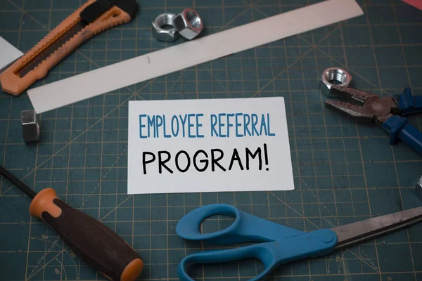 Handwriting text Employee Referral Program. Concept meaning internal recruitment method employed by organizations Carpentry equipments and plain paper scattered everywhere on measuring mat.